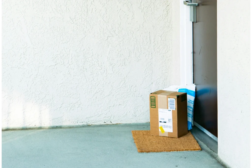Image of porch with a welcome mat with two large packages on the doorstep