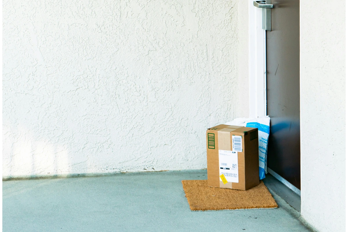 Image of porch with a welcome mat with two large packages on the doorstep