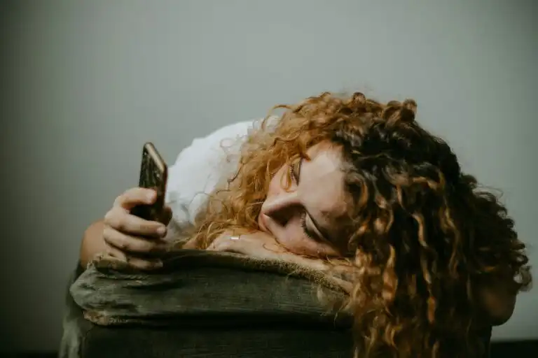 Person on their phone. Are ADHD and Phone Procrastination Related?