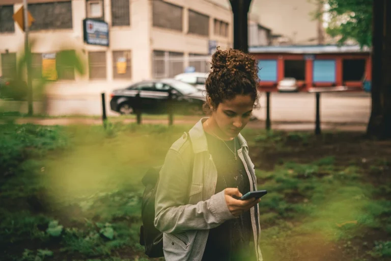 Image of person looking at their phone