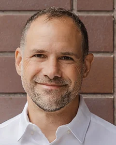 Headshot of Eli Singer, Certified Professional Coach, Toronto, Canada