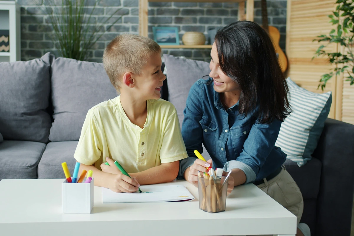 Image of parent and child drawing together